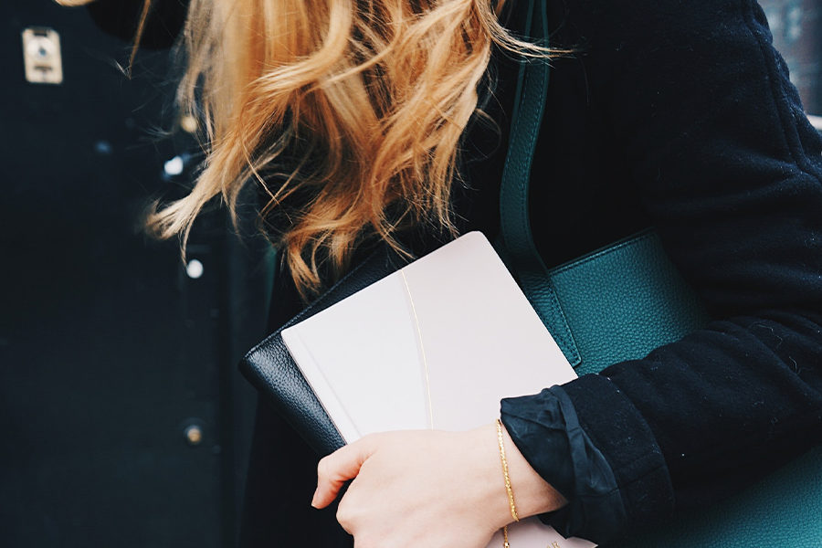 woman holding professional files