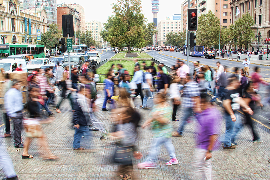 out of focus crowd crossing city street