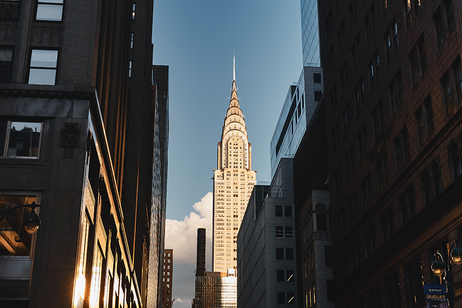 view of Chrysler Building at golden hour from NYC street