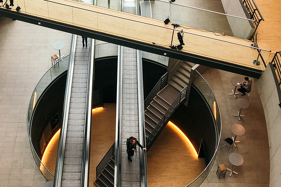 aerial view of atrium walkway and escalators