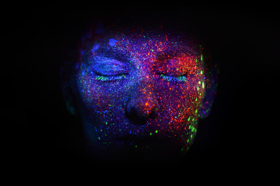 multicolored face in shadows