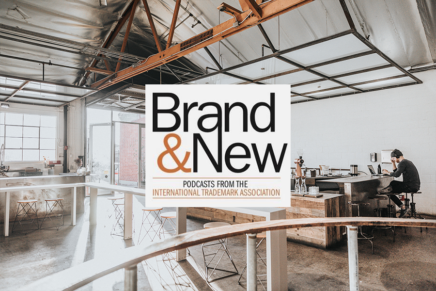 Brand & New Podcast logo with small coffee shop background