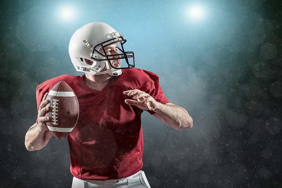 football player about to throw the ball