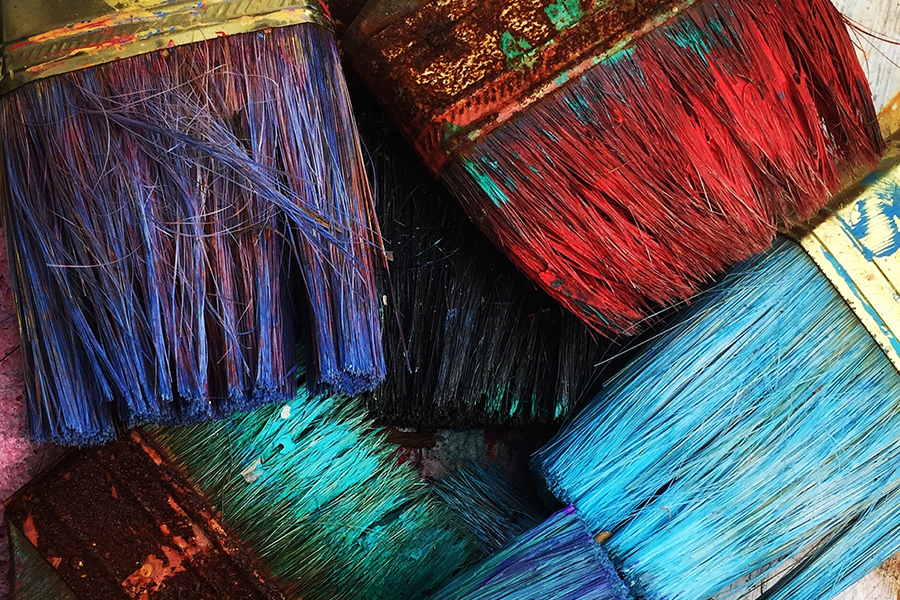 paintbrushes with colorful paint