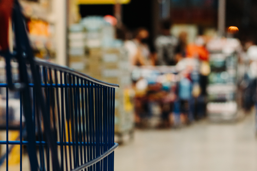 shopping cart with out-of-focus store in background