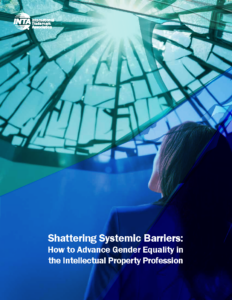 woman looking up at a blue glass ceiling with the report title