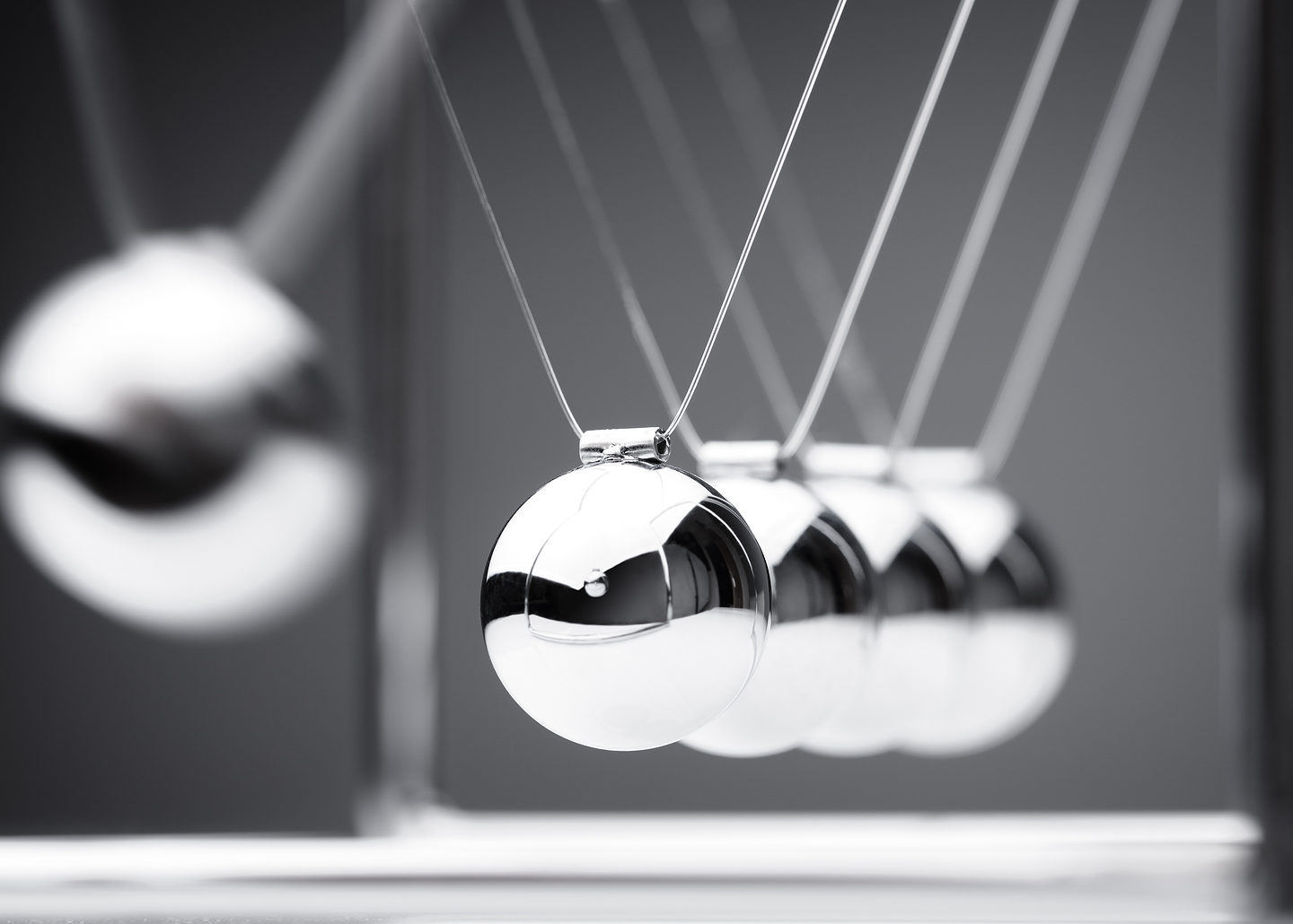 silver kinetic balls in motion