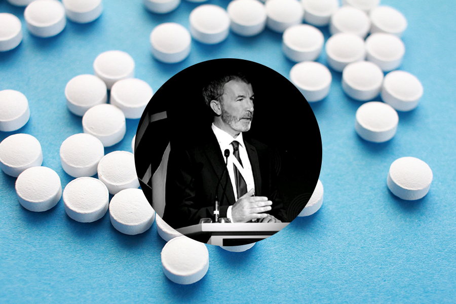 Rory Corcoran headshot over generic pills on blue baclground